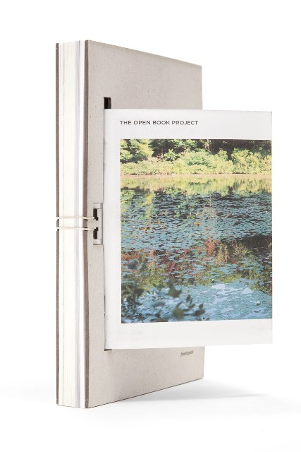 Dust jacket, that converts to a poster and can be trimmed and folded into a booklet